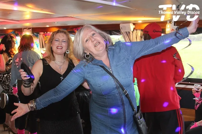 lady waving her arms at a disco