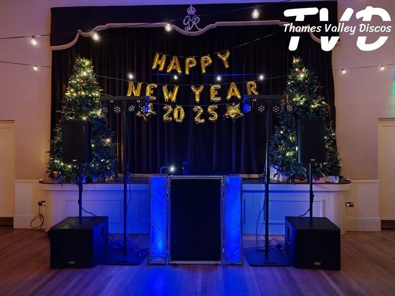 dj booth with New Years Eve banner behind