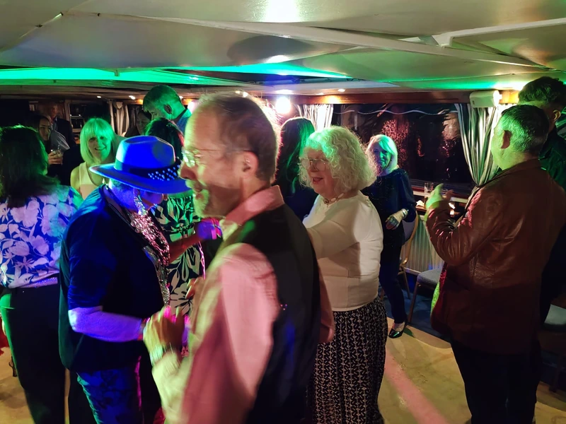 party on a boat man holding a drink