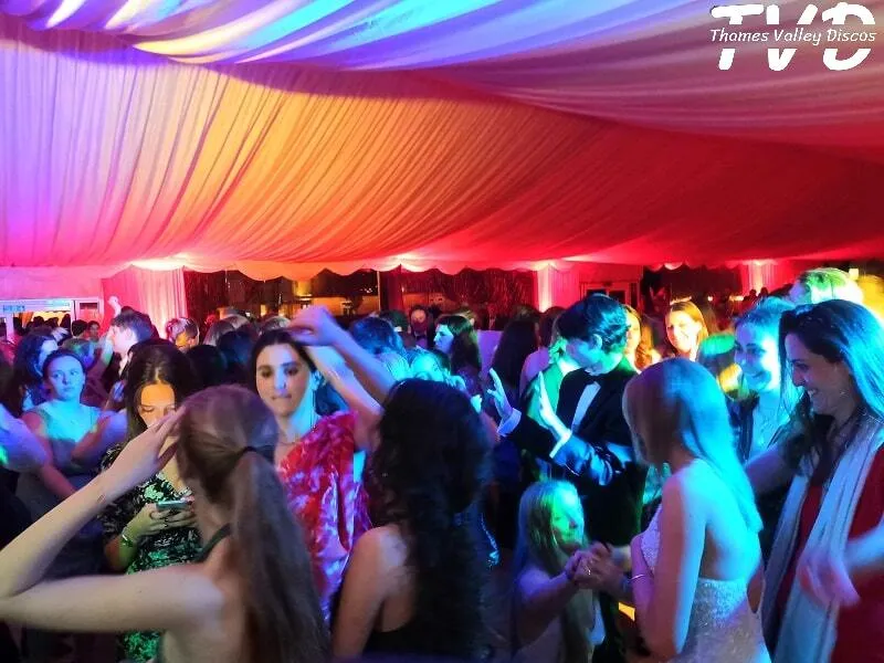 people dancing at a school prom