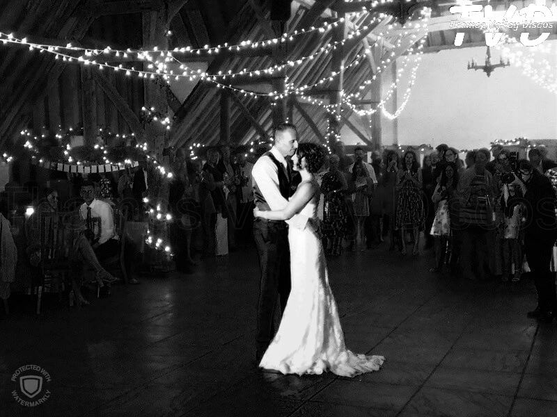 bride and groom having their first dance on a dancefloor