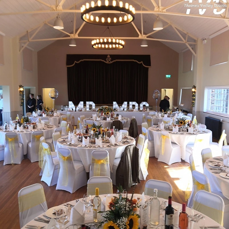 tables and chairs set with decorations
